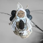 Lovely Unusual Handmade Shell Angel made of seashell, wooden dark wings and white cotton string.