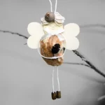 Perfect Handmade Shell Ornament - A Gift for The Seashell Lovers. Made of brownish seashell, wooden wings and corn.